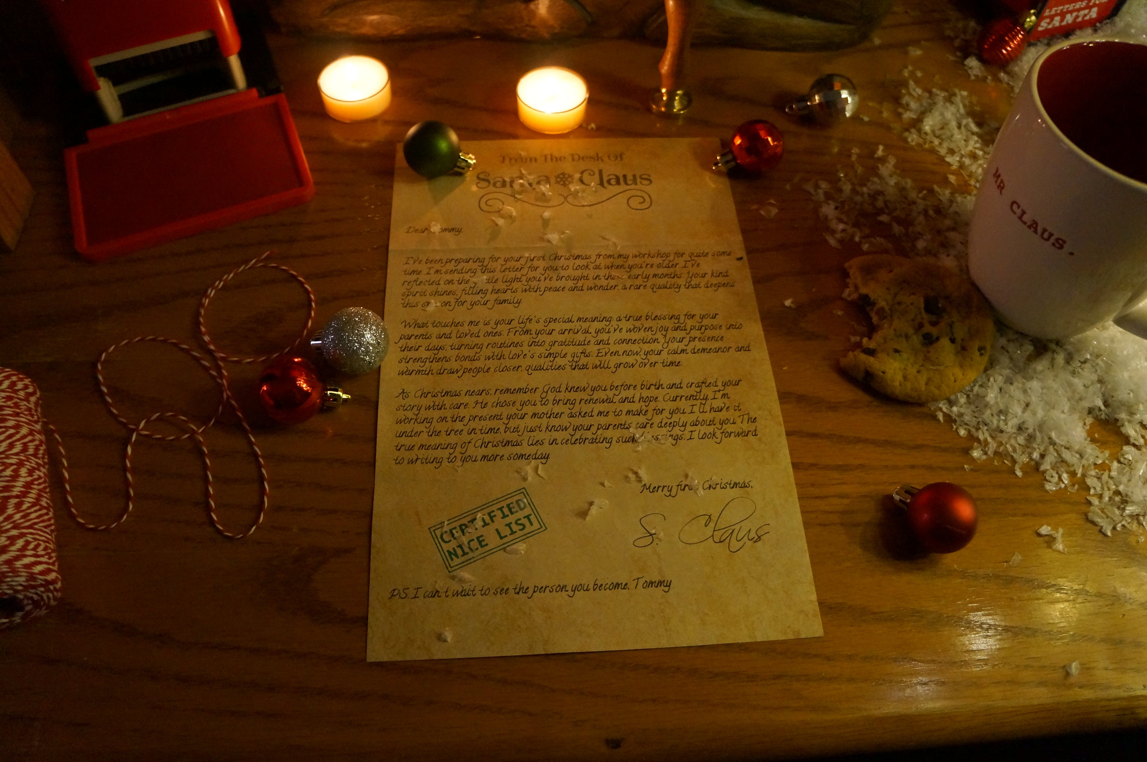 Letter from Santa Claus on a wooden table with Christmas decorations